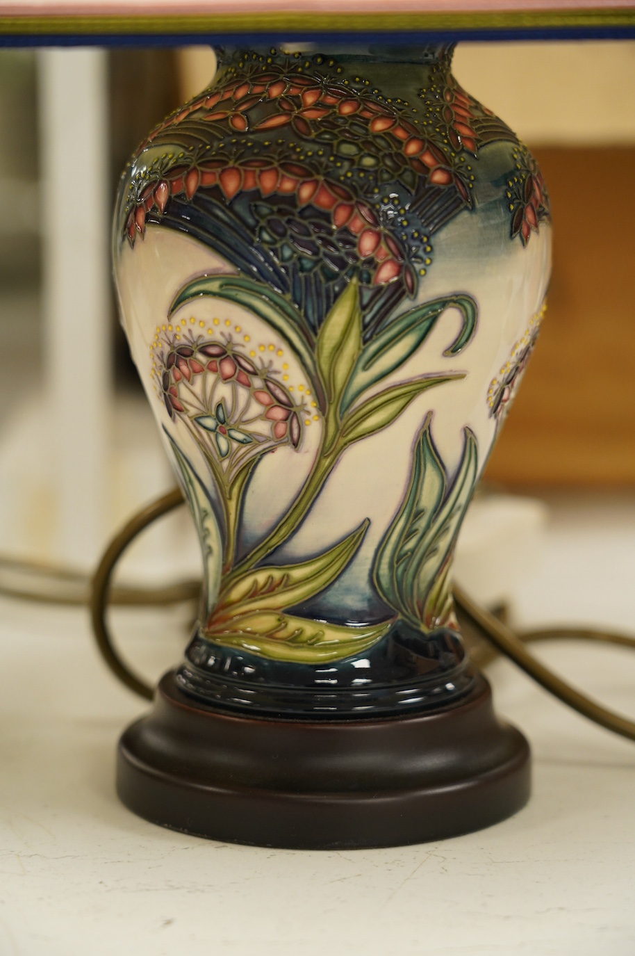 A Moorcroft lamp, shape 65/6, painter LB, with shade 37cm high. Condition - fair to good